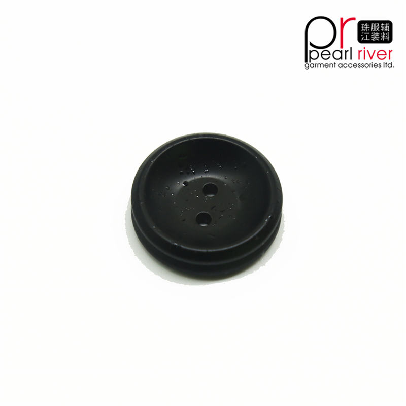 Botón de prenda redonda de color negro de última calidad.