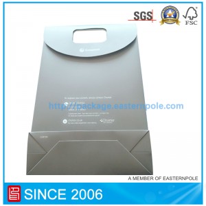 Bolsa de papel envolvente con cierre de velcro.