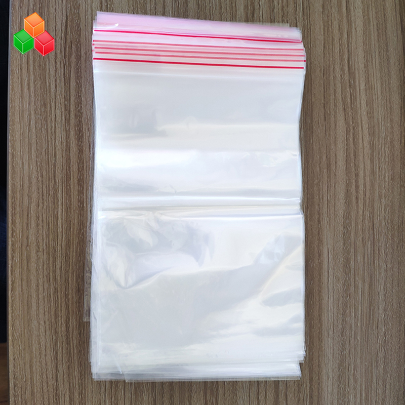 Precio de fábrica tamaño de impresión personalizado reutilizable sello de prensa transparente plástico PE PP zip lock bolsa de embalaje para alimentos / prendas de vestir