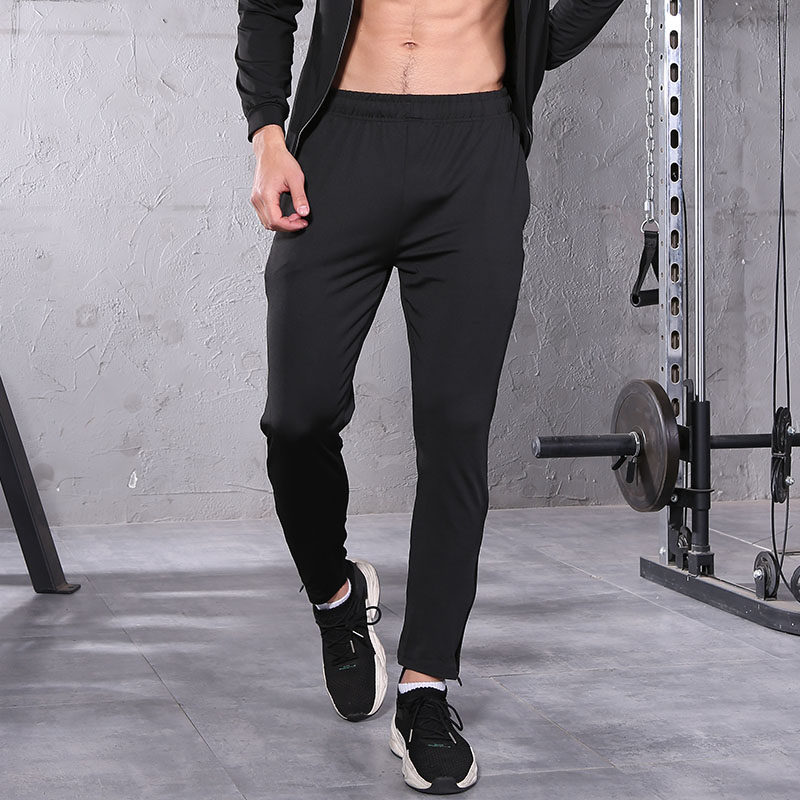 Pantalones de gimnasia, bolsillos de cremallera.