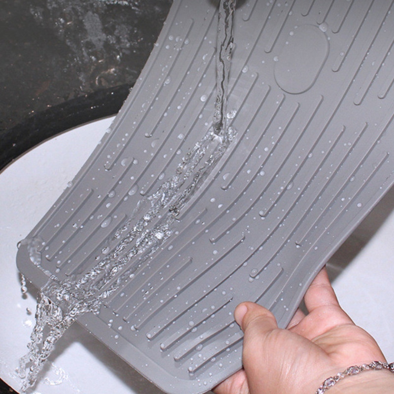 Botón rectangular para sujetar la almohadilla de drenaje