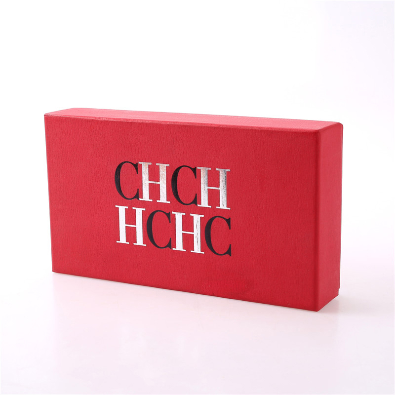 Caja de papel rojo con tapa.