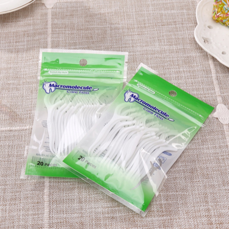 Etiqueta privada de alta calidad 20 PCS bolsa de embalaje dental hilo dental palillos al por mayor de hilo dental barato