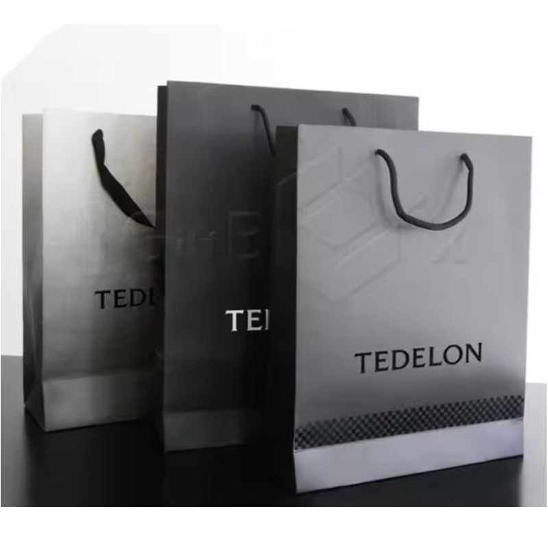 Bolsa de papel de envasado de regalos de compras laminado impreso personalizado de lujo con su propio logotipo