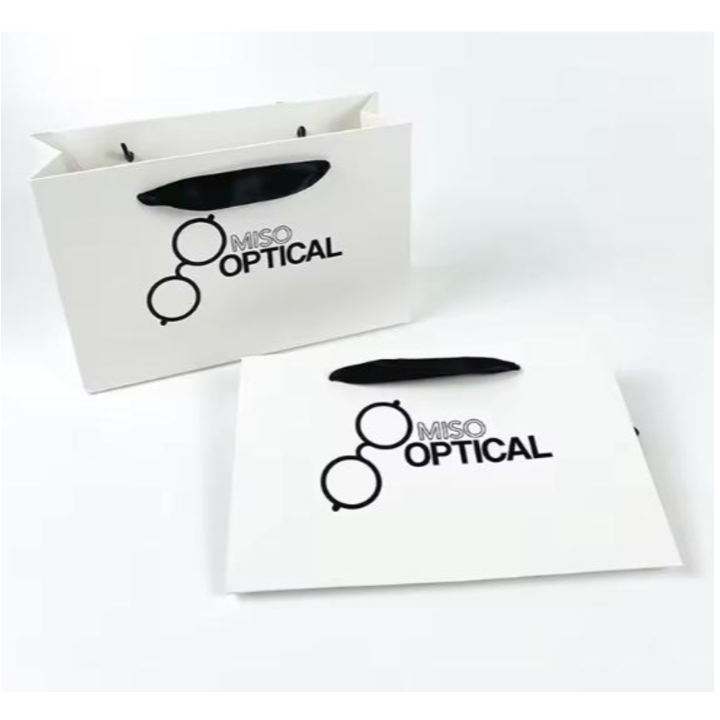 Bolsas de papel impresas Cardboard Luxury White Kraft Paper Bolde de regalo con mango de cinta para la bolsa de compras con su propio logotipo